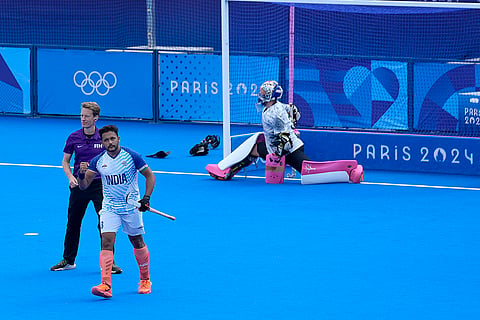 Harmanpreet Singh celebrates after scoring his side's third goal 